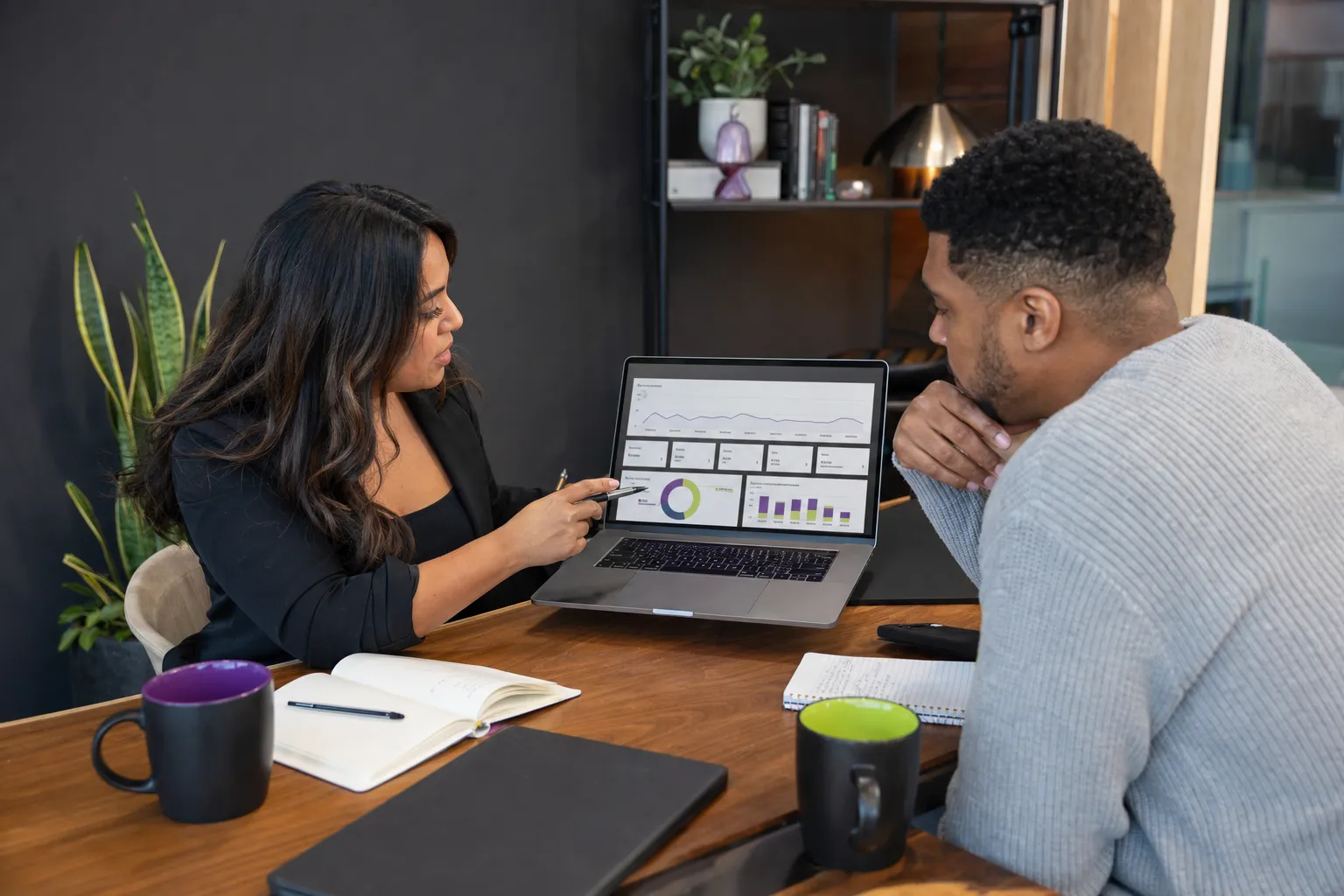Business owner reviewing paid search campaign performance with a specialist