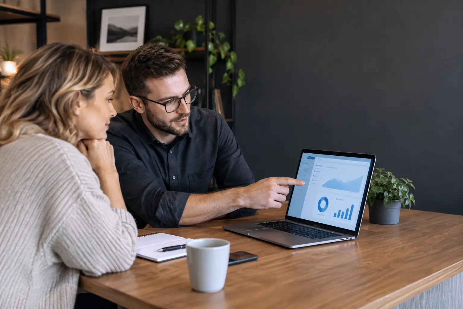 Website specialist reviewing a maintenance report with a business owner